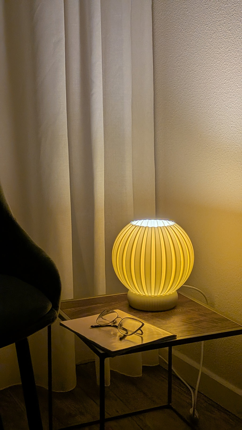 Glune table lamp glowing at night, warm atmosphere